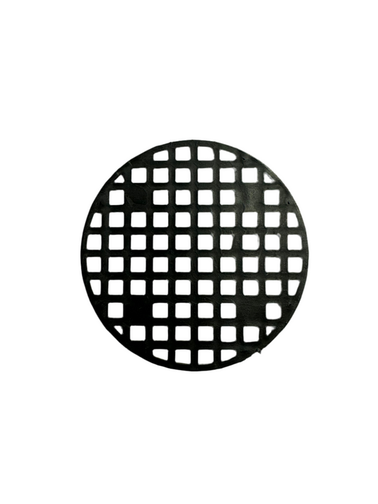 A photo of a black round drainage hole cover with a square grid with a solid white background. 