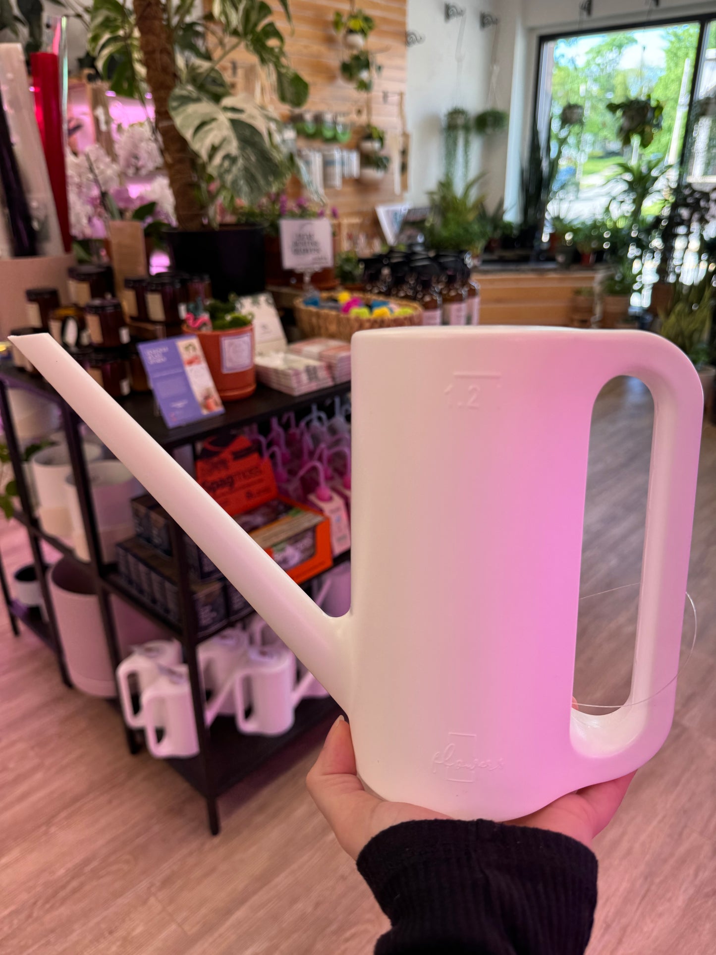 White plastic watering can 